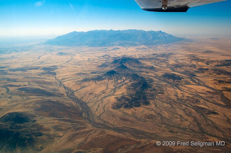 20090603_105422 D3 X1.jpg - The second leg of our journey takes us  North, flying farther inland as the coast slopes West.  Imagine that we are now relatively close to the site on the coast where Diego Cao, a Portugeuse explorer erected a limestone cross in 1486!!!